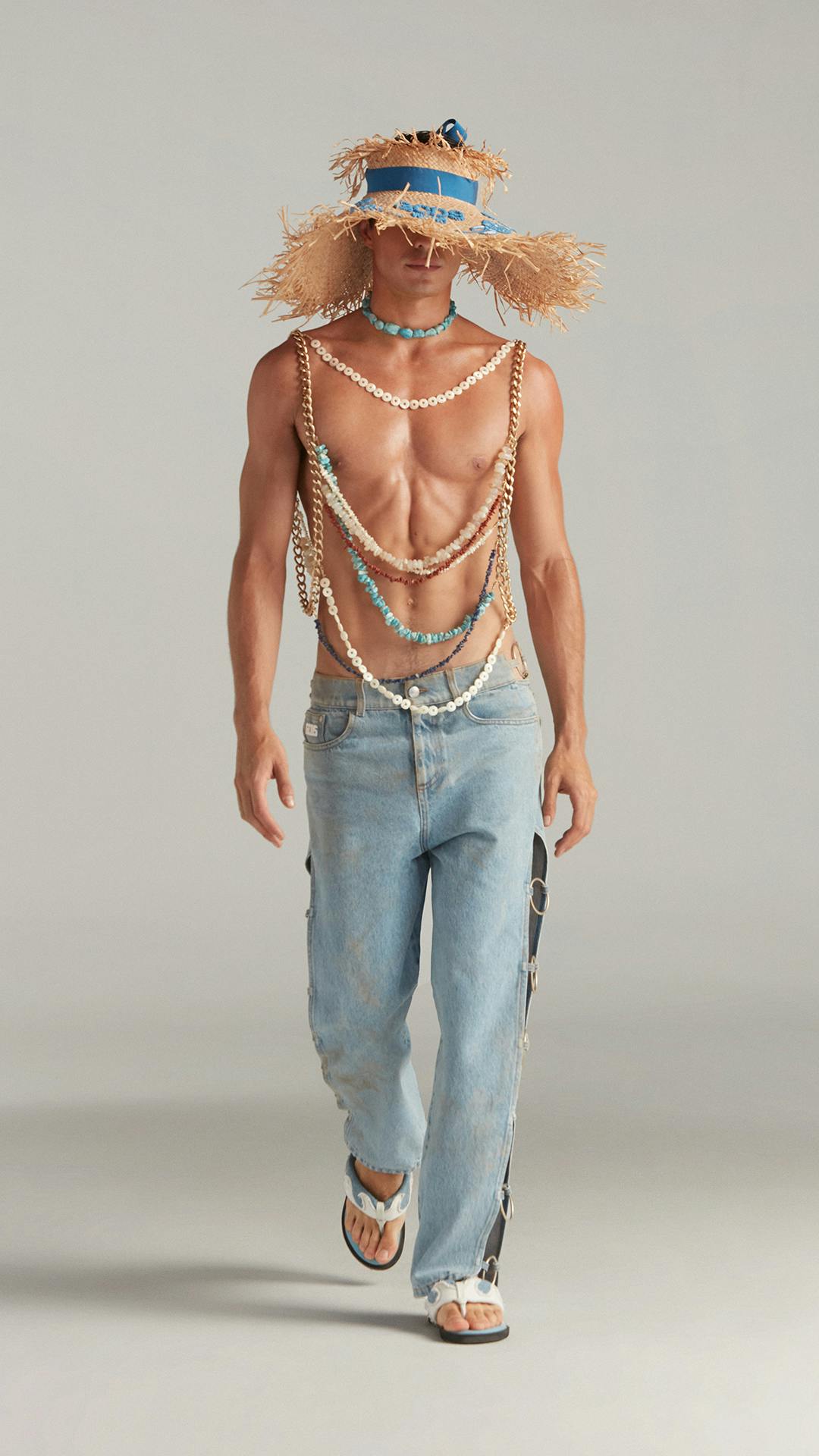 SUMMER LOOK WITH LATERAL-EMBELLISHED DENIM, STRAW HAT AND HAND-MADE CHAIN VEST